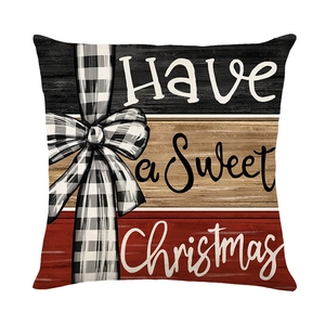 Christmas snowman pillow cover with black white plaid bow and Sweet Christmas text slogan