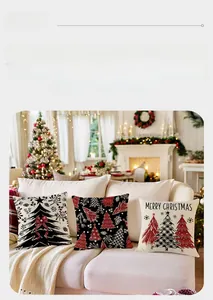 Close-up of three Christmas pillow covers with festive prints on a cozy sofa