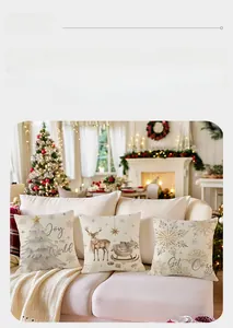 Detailed view of linen Christmas pillowcases with watercolor trees and reindeer patterns