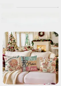 Detail of Christmas pillowcases with gingerbread man and festive typography designs