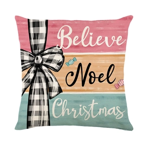 Christmas pillow cover with Believe Noel Christmas text and plaid bow on striped fabric