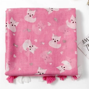 Close-up of pink fox and heart print scarf featuring dense dual-tone fringe tassels