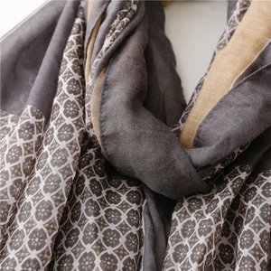 Close-up of elegant floral pattern on breathable cotton linen scarf with soft texture