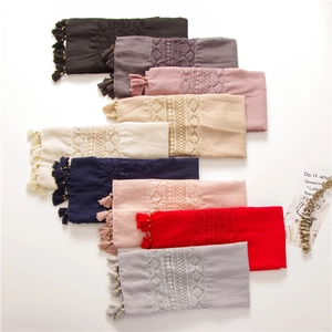 Lightweight cotton scarves with floral embroidery and tassels in various colors