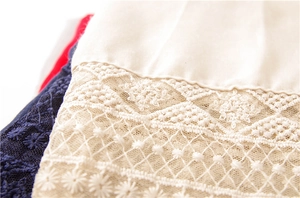Close-up of elegant embroidery lace stitching on cotton summer scarf pashmina