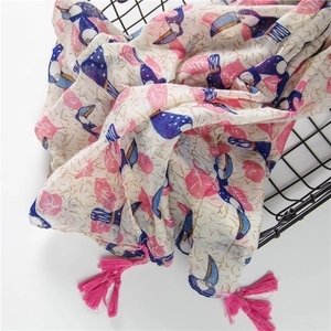 Lightweight cotton-linen feel scarf with blue pelican print and pink tassel fringe