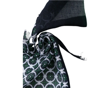 Elegant polka dot scarf with vintage geometric patterns and subtle fringe detailing