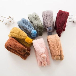 Plush baby scarf with faux fur pom-poms in multiple colors for winter warmth