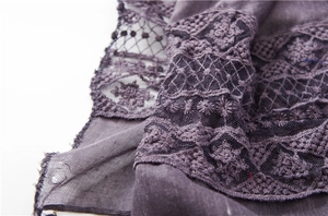 Detailed close-up of dark mauve cotton scarf featuring intricate floral lace embroidery