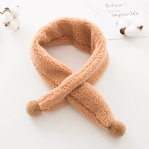 Detail of plush brown teddy fleece scarf with soft pom poms for toddlers and kids