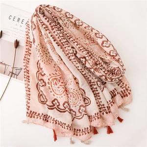 Ethnic style beige scarf with red paisley patterns and tassel trim for summer beachwear
