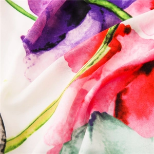 Macro detail of high-quality watercolor floral pattern on soft chiffon fabric