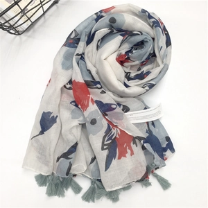 Floral print lightweight cotton linen scarf with green tassels on white background