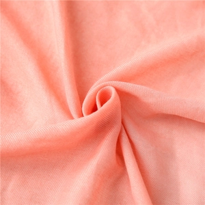 Detailed close-up of soft peach cotton scarf showing premium twill weave fabric texture