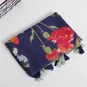 Floral print cotton scarf with red poppies, butterflies, and fringed tassels in navy blue
