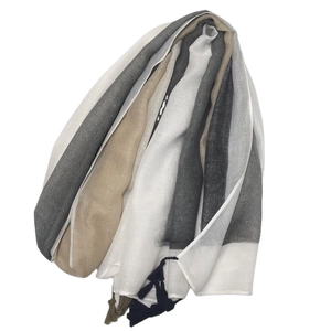 Elegant striped cotton scarf with tassels in grey, beige, and white for beach sun protection