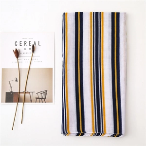 Linen cotton striped scarf shawl in yellow blue and grey displayed on a white background