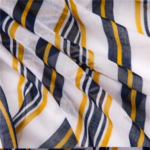 Detail of striped cotton linen fabric showing soft texture and breathable weave pattern