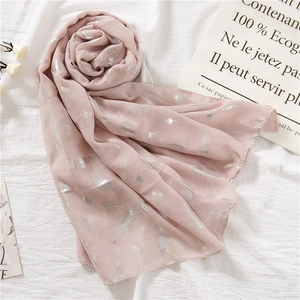 Elegant pale pink linen scarf featuring metallic silver feather patterns for women