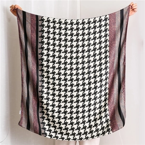 Detail view of cotton-linen feel scarf featuring houndstooth and leopard print patchwork