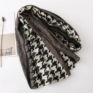 Detail shot of vintage houndstooth scarf with elegant dark brown lace stitching edge