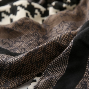 Detail of cotton-linen scarf showing houndstooth, lace floral and honeycomb textures