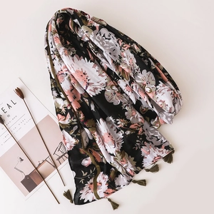 Bohemian floral beach scarf in black cotton linen with green tassel edge for women