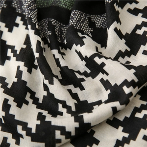 Close-up of classic black and white houndstooth fabric with fine woven texture detail