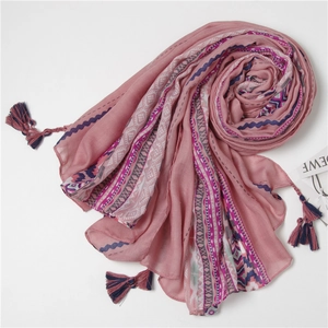 Bohemian pink print scarf with ethnic tassels and geometric patterns for travel sun protection
