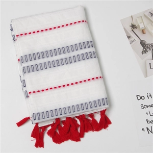 White cotton linen scarf with gray rectangle patterns and red tassels for sun protection