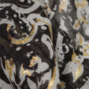 Elegant paisley printed scarf with gold foil details and lightweight breathable fabric