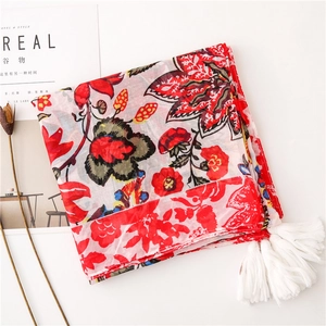 Floral Bali yarn shawl with red flower prints and tassels for beach and autumn styling