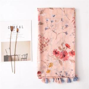 Floral print cotton linen long scarf with tassels on white minimalist background