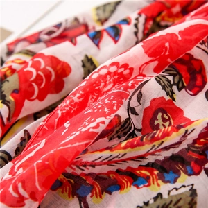 Close-up of lightweight floral Bali yarn scarf with vibrant bohemian print patterns