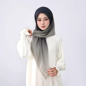Detail of gradient grey and black chiffon hijab showing smooth material and elegant draping