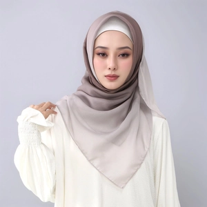 Detail of soft gradient voile hijab showing beige to taupe transition on a female model