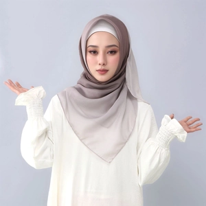 Detail of gradient coffee to grey voile headscarf with soft drape and lightweight texture