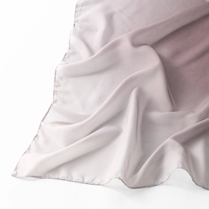 Detailed view of the gradient voile scarf showing the purple fabric texture and hem