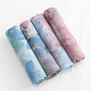 Detailed view of four lightweight floral chiffon scarves in various colors and patterns