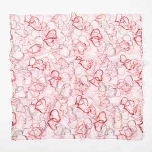 Close-up of heart print pattern on lightweight semi-transparent floral voile scarf
