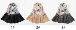 Detailed close-up of three floral print voile scarves in black, coffee, and grey tones