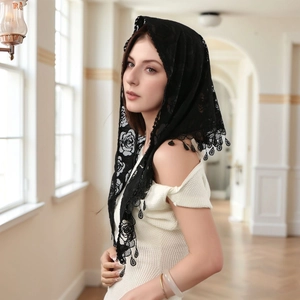 Detail of black rose lace church veil featuring intricate hollow pendant fringe tassels