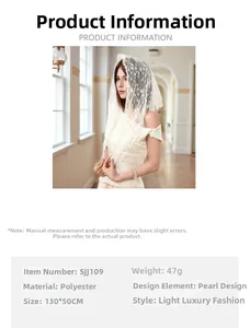 Detailed view of white lace triangle scarf with pearl accents and sizing specifications