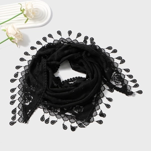 Detail view of black floral lace bridal shawl with delicate teardrop lace edges