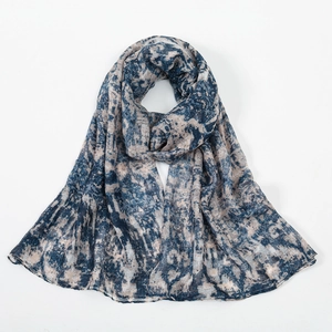 Detailed close-up of soft floral print voile scarf showing fabric texture and navy pattern