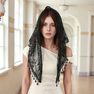 Detailed close-up of floral black lace mantilla veil with teardrop trim fringe edges