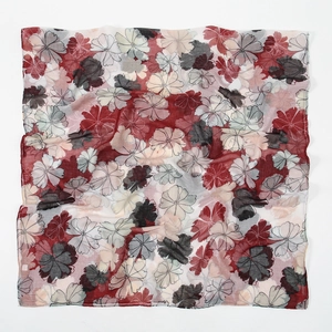 Detail of floral printed bali yarn scarf showing lightweight texture and hemmed edges