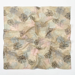Detail of soft floral bali yarn shawl showing light pink and blue floral patterns
