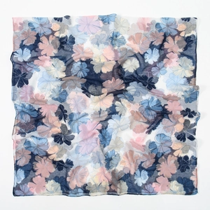 Detail of floral printed voile scarf showing semi-transparent fabric and soft drape texture