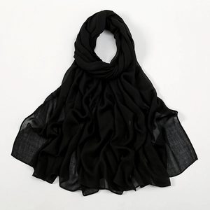 Detail showing high-quality black chiffon hijab fabric with soft drape and lightweight texture